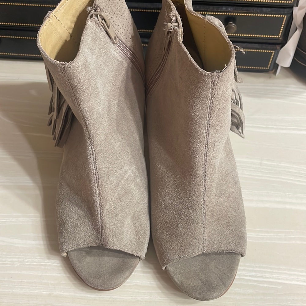 Suede peep toe booties with fringe